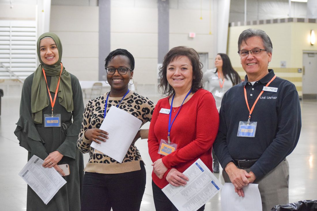 Bayane Alem, Irene Muthui, Gerry Gagnon, and Mark Crail greet employers at the 2020 Career Life Expo.