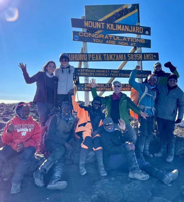 Ash Goel (far right) with the climbers and guides at the summit of Mount Kilimanjaro (Aug. 27, 2021).