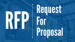 Background is an image of a man and a woman in a manufacturing setting, wearing hardhats and looking at a computer. Overlaid text says: RFP - Request for Proposal.